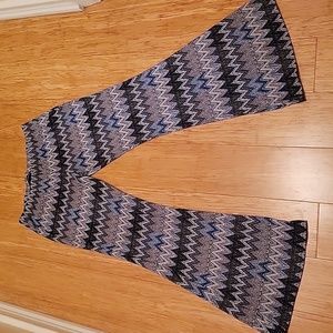 Blue chevron print poly stretch pants. Size M